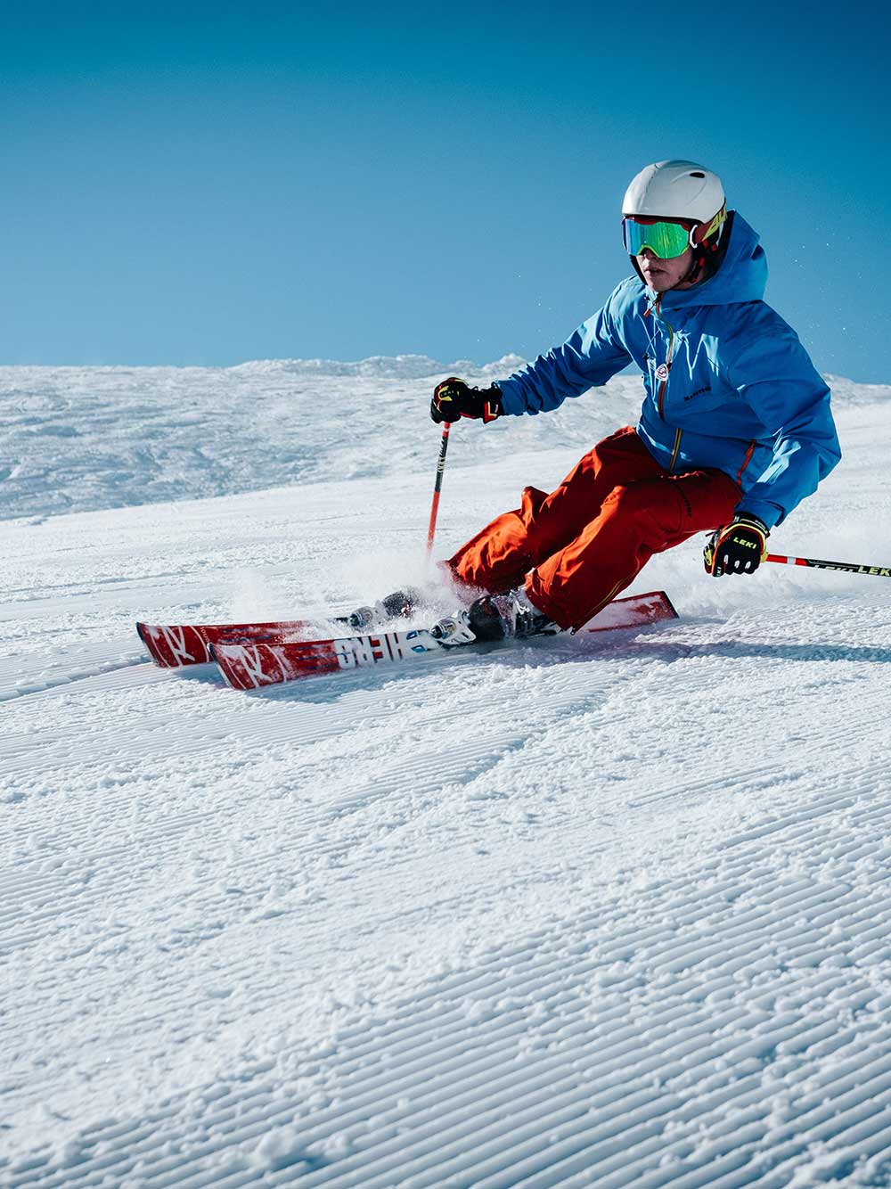 A man skiing in the snowy mountains